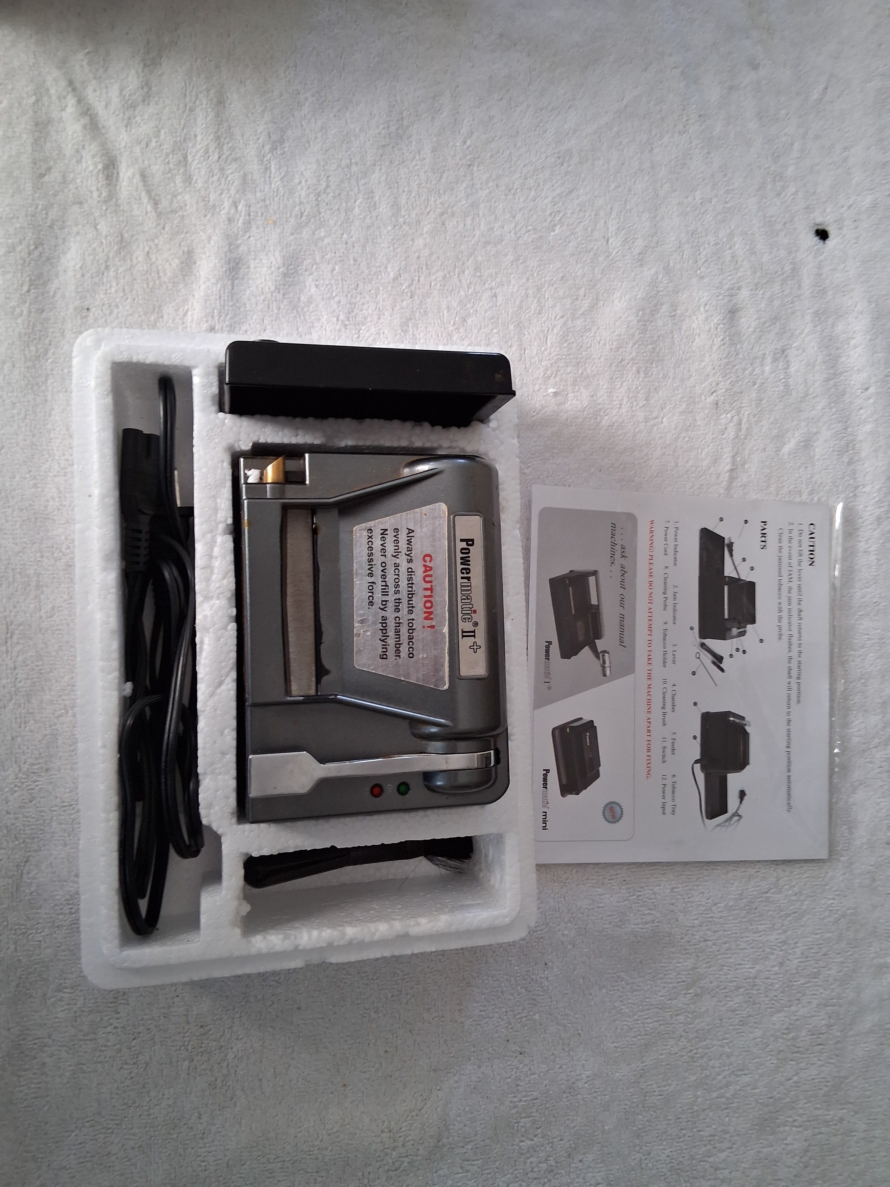 Gently used electric cigarette making machine.